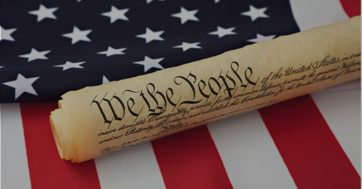 U.S. flag and We the People Constitution highlighting the importance of history education in public schools